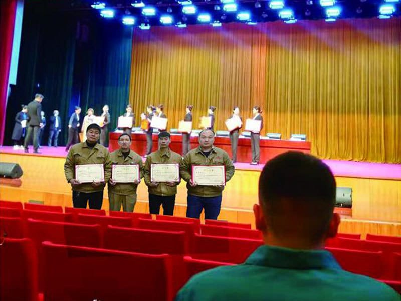Gaoshan Valves employees receiving awards at the 2nd Xingyang Vocational Skills Competition for CNC Turning